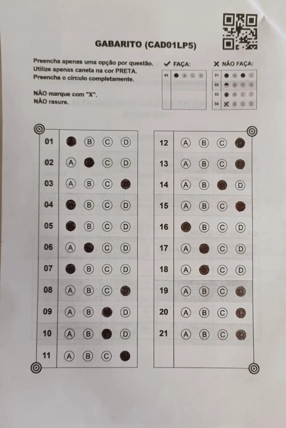 A photographed answer sheet with 21 questions, one option filled in for each.